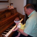 Ted Lewis teaching Evelynn to play the piano. Ted Lewis teaching Evelynn to play the piano.